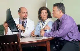 couple talking with a medical consultant