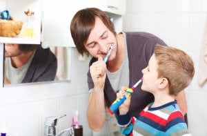 brushing teeth with fluoride toothpaste