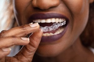 woman using clearcorrect aligners