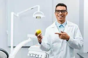 dentist holding apple