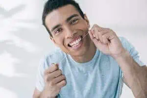 man flossing