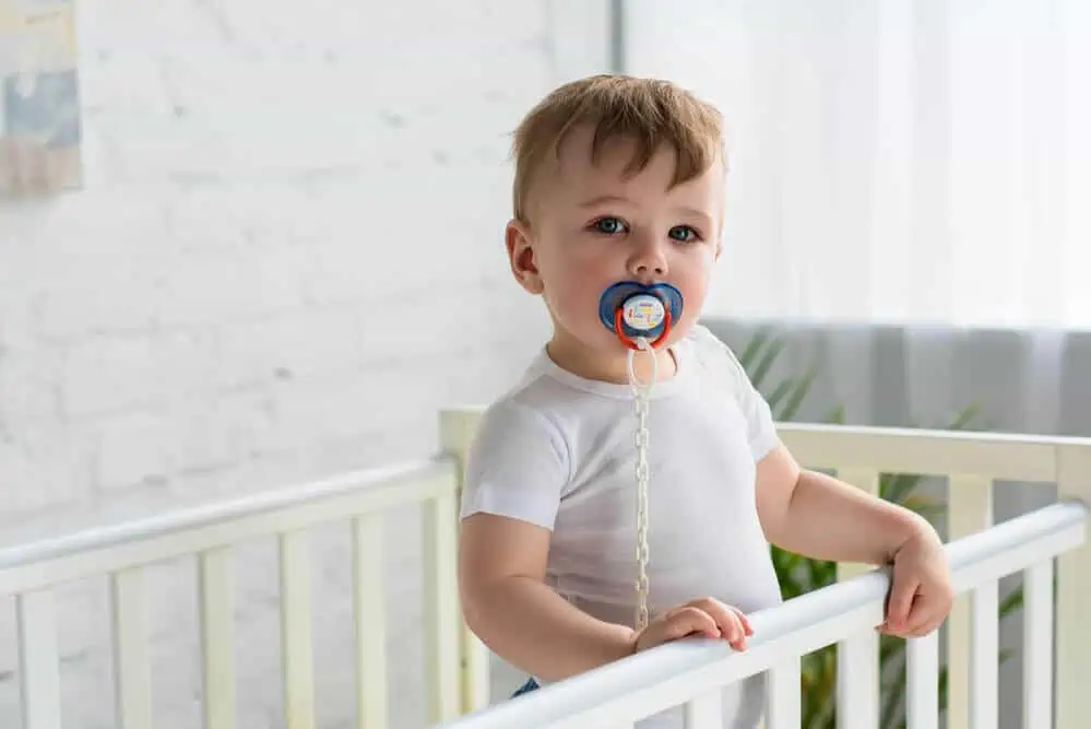 Child sucking a dummy teeth