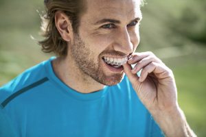 man using invisalign for overbite