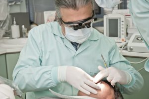 examining infected tooth