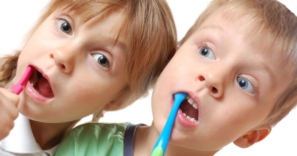 children with toothbrushes