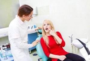 woman worried about tooth cavity