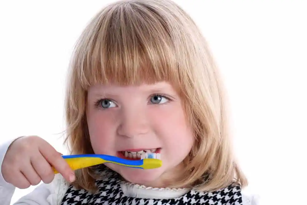 child brushing teeth