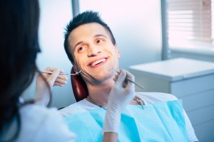 Man receiving dental implant consultation