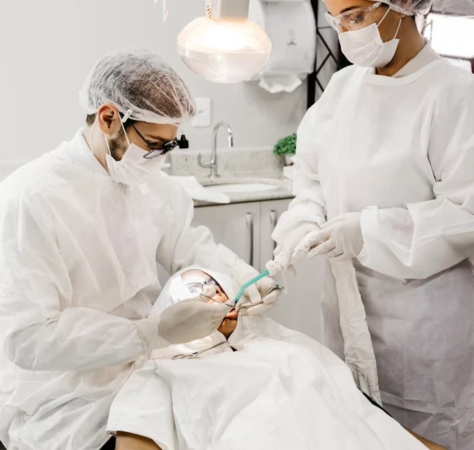 Dental team performing an oral surgery procedure