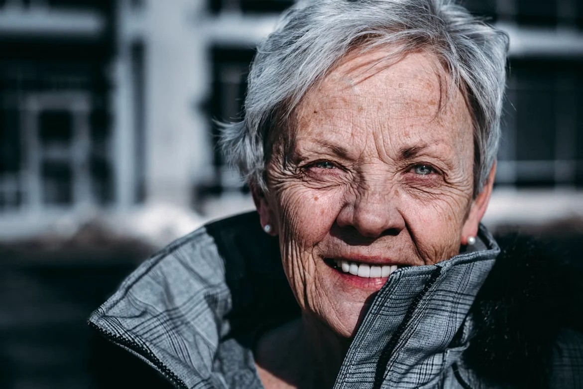 Smiling older woman with short gray hair