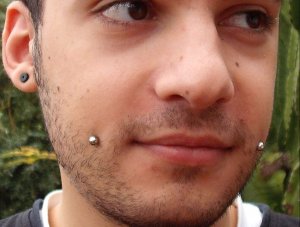 cheek piercing