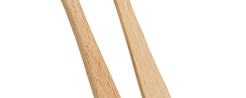 Two bamboo toothbrushes with soft bristles, one featuring a circular hole in the handle, against a green background.